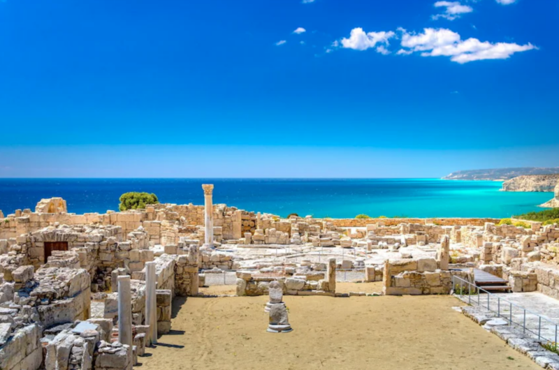 Ancient ruins and stone columns of Kourion archaeological site overlooking the blue Mediterranean Sea in Cyprus.