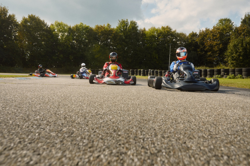 Go-kart racers in colourful karts speeding around the track at Paphos Karting in Cyprus.