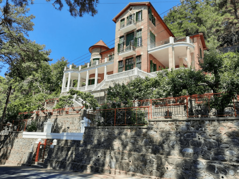 Elegant villa in Platres surrounded by trees and greenery in the mountains of Cyprus.